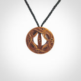 Hand carved Japanese design pendant. Yuri Terenyi has carved this from Bone and stained it with his homemade dye. This is a delightful, medium sized and artistic piece of jewellery. One only necklace.